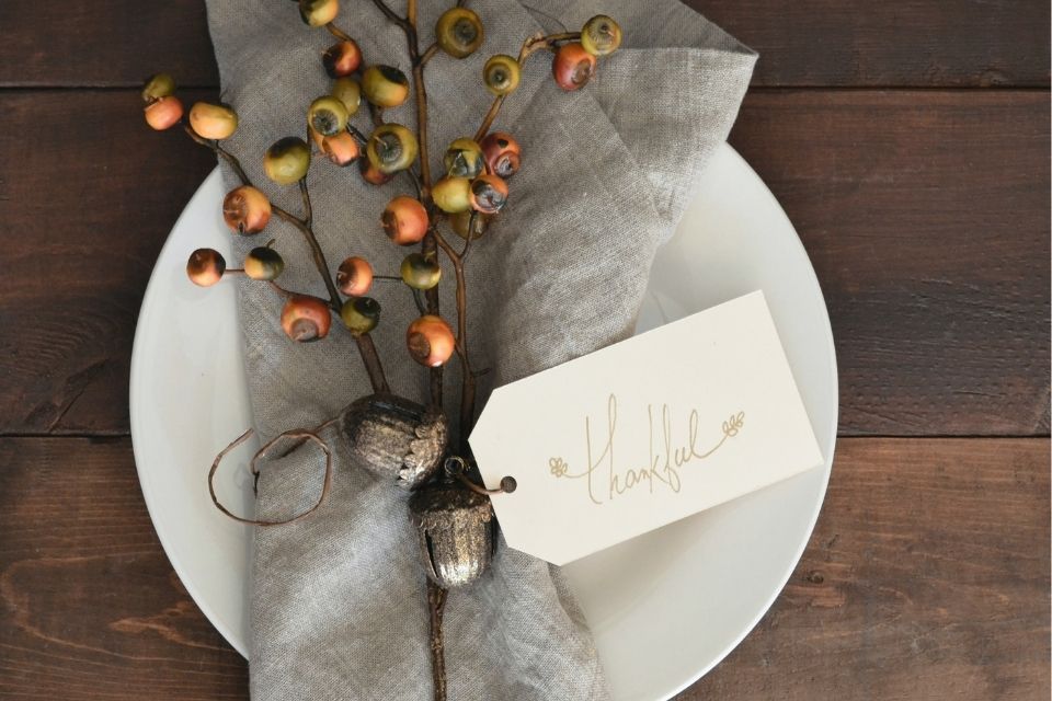 Thanksgiving place setting decor for dinner party with hand written note